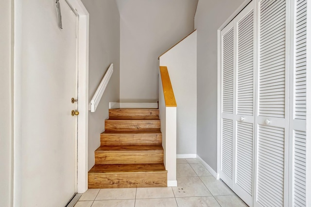 stairs with tile patterned floors