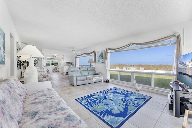 1470 S Ocean Blvd Unit 1201, Lauderdale By The Sea, FL 33062 - living room featuring tile patterned floors, a textured ceiling, and a ceiling fan