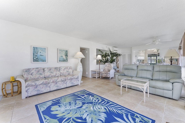 1470 S Ocean Blvd Unit 1201, Lauderdale By The Sea, FL 33062 - living area featuring a textured ceiling, a ceiling fan, and light tile patterned flooring