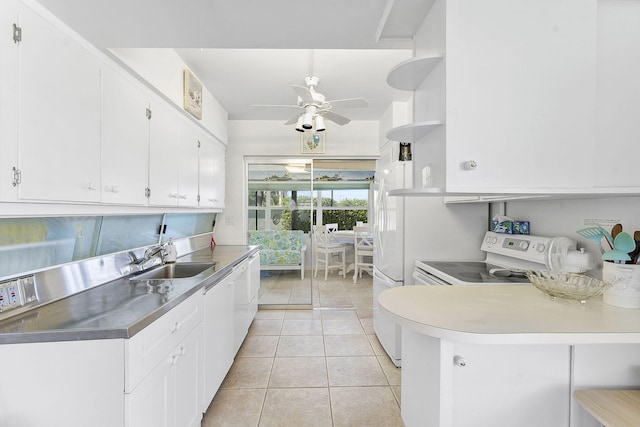 1470 S Ocean Blvd Unit 1201, Lauderdale By The Sea, FL 33062 - kitchen with open shelves, stainless steel countertops, a sink, white cabinets, and range with electric stovetop