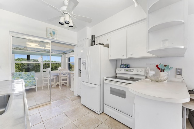 1470 S Ocean Blvd Unit 1201, Lauderdale By The Sea, FL 33062 - kitchen with white appliances, white cabinets, light countertops, open shelves, and light tile patterned flooring