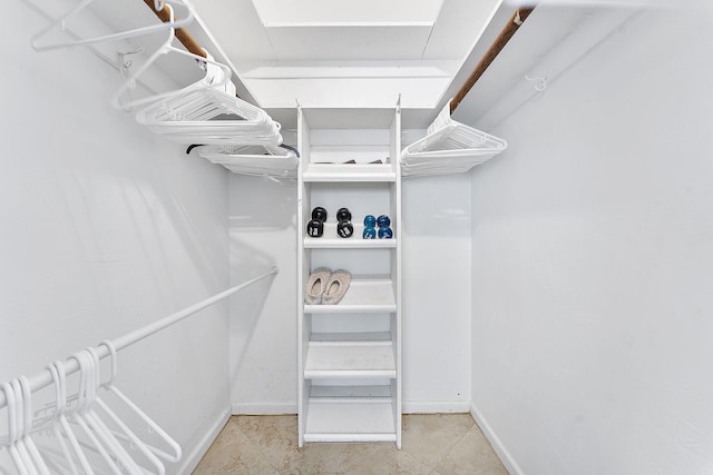1470 S Ocean Blvd Unit 1201, Lauderdale By The Sea, FL 33062 - walk in closet featuring tile patterned flooring