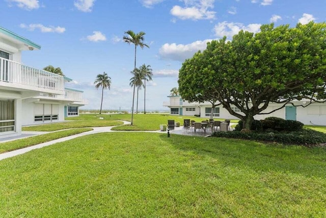 1470 S Ocean Blvd Unit 1201, Lauderdale By The Sea, FL 33062 - view of green lawn featuring a patio area