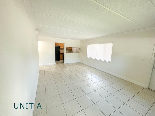 817 Lighthouse Dr Unit A, B, C, D, North Palm Beach, FL 33408 - unfurnished living room featuring crown molding, light tile patterned flooring, a textured ceiling, and baseboards