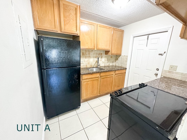 817 Lighthouse Dr Unit A, B, C, D, North Palm Beach, FL 33408 - kitchen featuring black appliances, a sink, tasteful backsplash, light tile patterned floors, and a textured ceiling