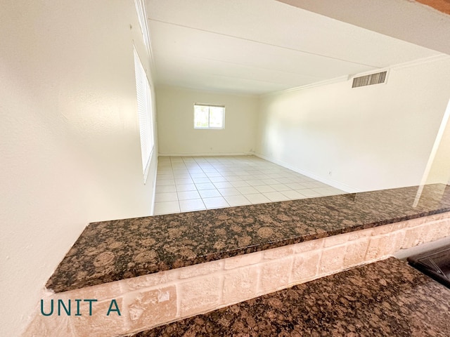 817 Lighthouse Dr Unit A, B, C, D, North Palm Beach, FL 33408 - tiled spare room featuring baseboards and crown molding