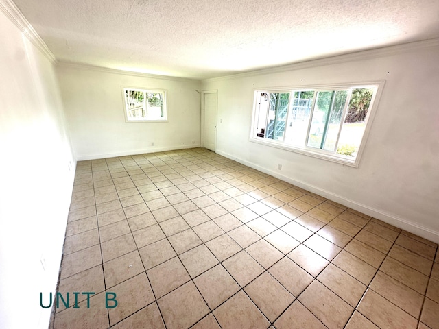 817 Lighthouse Dr Unit A, B, C, D, North Palm Beach, FL 33408 - empty room featuring ornamental molding, a textured ceiling, light tile patterned floors, and baseboards