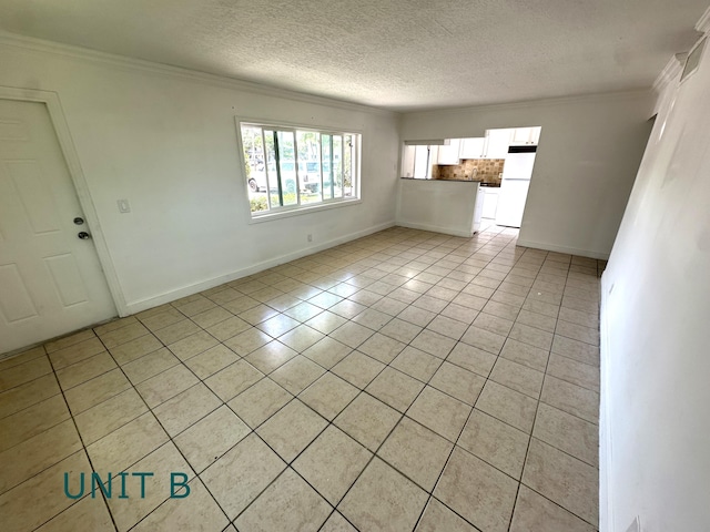 817 Lighthouse Dr Unit A, B, C, D, North Palm Beach, FL 33408 - unfurnished living room featuring light tile patterned flooring, ornamental molding, a textured ceiling, and baseboards
