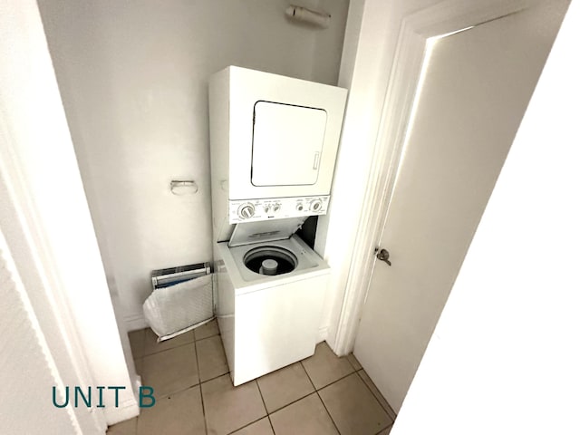 817 Lighthouse Dr Unit A, B, C, D, North Palm Beach, FL 33408 - laundry area with stacked washer / drying machine and light tile patterned floors