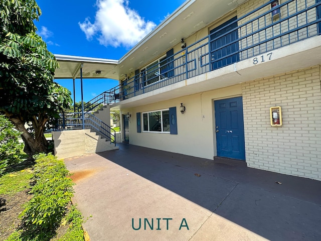 817 Lighthouse Dr Unit A, B, C, D, North Palm Beach, FL 33408 - view of exterior entry with brick siding