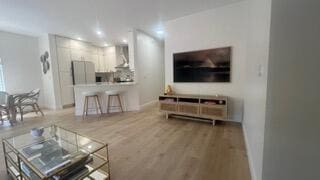 203 Evergrene Pkwy, Palm Beach Gardens, FL 33410 - living area featuring wood finished floors, recessed lighting, and baseboards