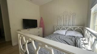 203 Evergrene Pkwy, Palm Beach Gardens, FL 33410 - bedroom featuring wood finished floors