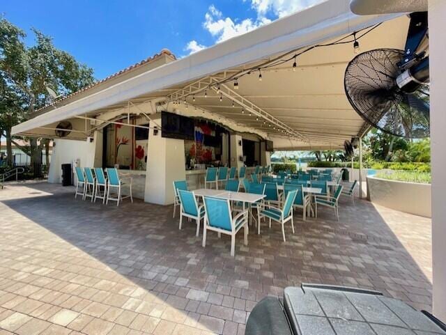 203 Evergrene Pkwy, Palm Beach Gardens, FL 33410 - view of patio / terrace with outdoor dining space