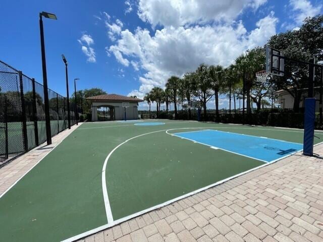 203 Evergrene Pkwy, Palm Beach Gardens, FL 33410 - view of basketball court with fence and community basketball court