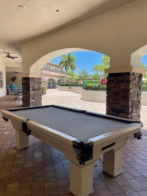 203 Evergrene Pkwy, Palm Beach Gardens, FL 33410 - playroom with billiards, arched walkways, and a ceiling fan