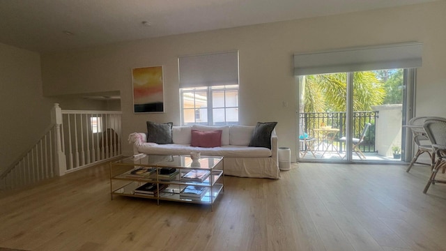 203 Evergrene Pkwy, Palm Beach Gardens, FL 33410 - living room with healthy amount of natural light and wood finished floors