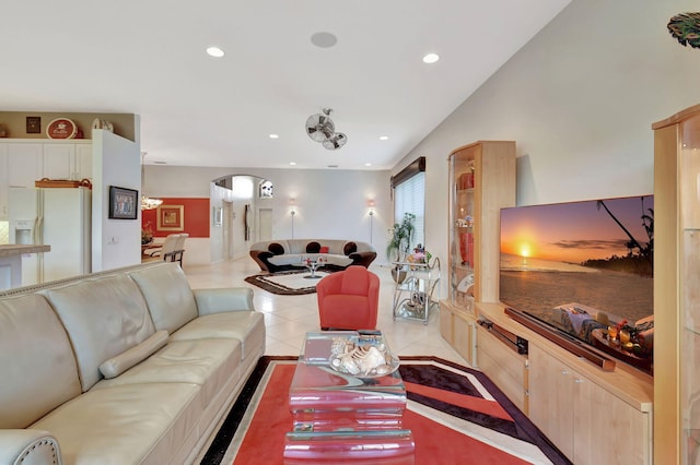 living area with arched walkways and recessed lighting