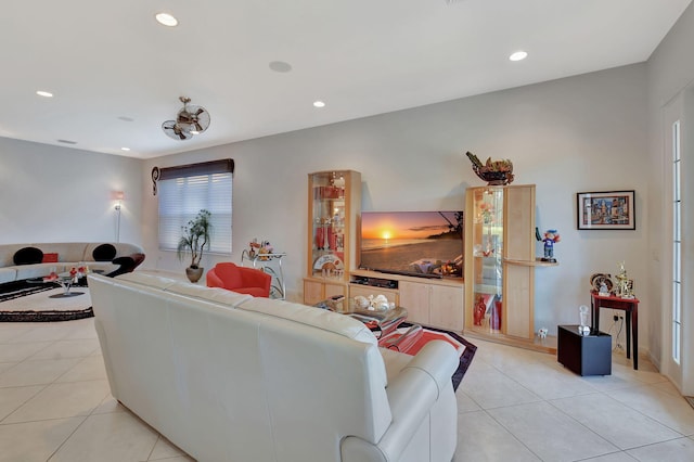 living room with recessed lighting and light tile patterned floors