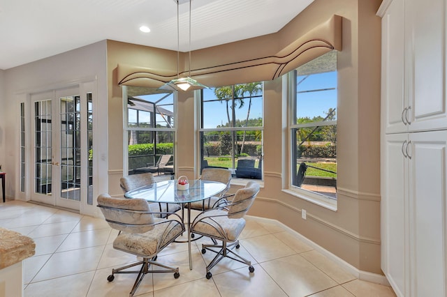 dining space featuring light tile patterned flooring, healthy amount of natural light, recessed lighting, and baseboards