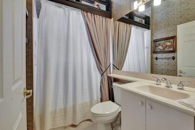 full bathroom with toilet, vanity, wallpapered walls, and a shower with shower curtain