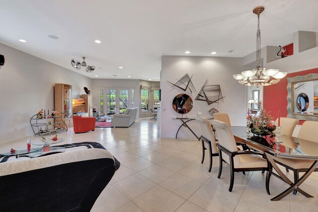 living area with recessed lighting, a chandelier, and light tile patterned floors