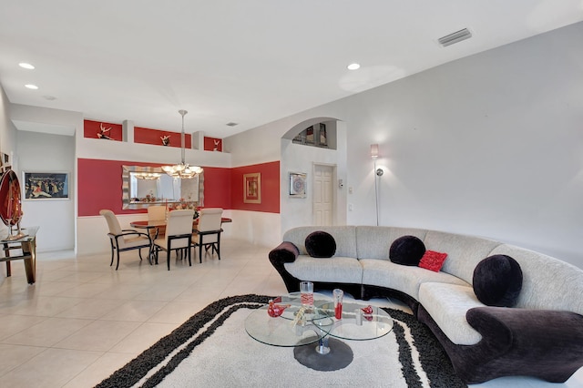 living room featuring a chandelier, light tile patterned flooring, and recessed lighting