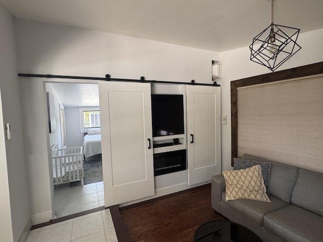 387 Enfield St, Boca Raton, FL 33487 - living area featuring a barn door and baseboards