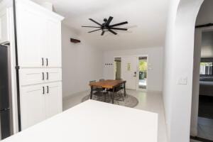 387 Enfield St, Boca Raton, FL 33487 - dining space featuring arched walkways, a ceiling fan, and lofted ceiling
