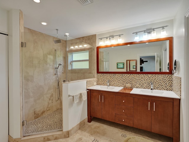 bathroom with a shower stall, backsplash, double vanity, tile patterned flooring, and recessed lighting