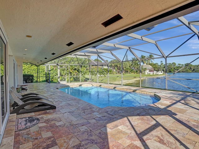 outdoor pool with a patio, a water view, and a lanai