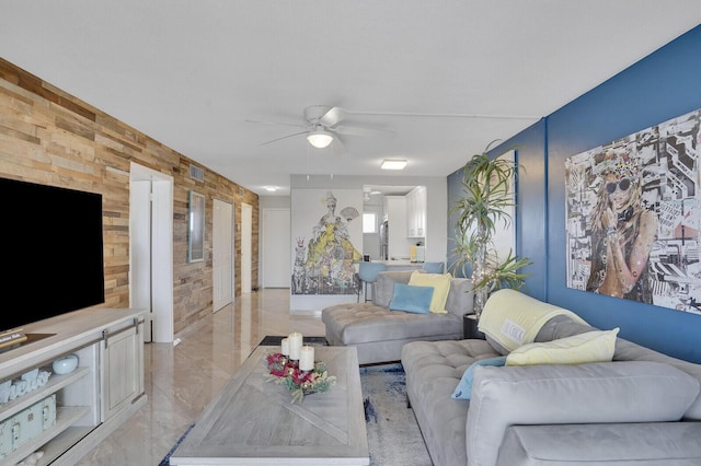 2724 N Garden Dr Unit 302, Lake Worth, FL 33461 - living room featuring a ceiling fan and wood walls