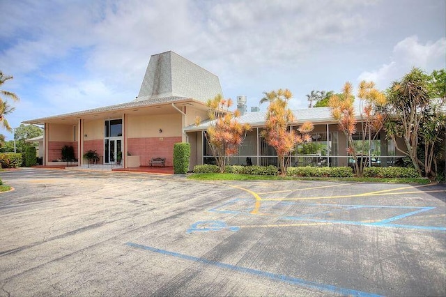 2724 N Garden Dr Unit 302, Lake Worth, FL 33461 - view of building exterior with uncovered parking
