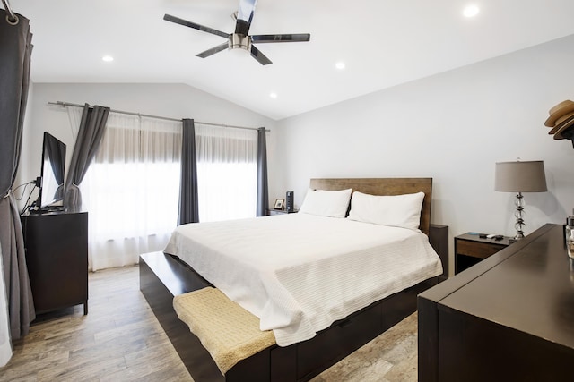 bedroom with light wood finished floors, vaulted ceiling, ceiling fan, and recessed lighting