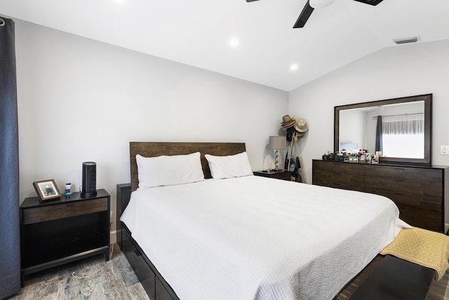 bedroom with wood finished floors, lofted ceiling, ceiling fan, and recessed lighting