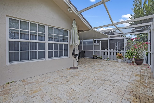 view of patio with a lanai