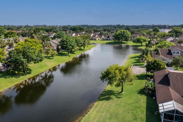 aerial view of residential area with a nearby body of water