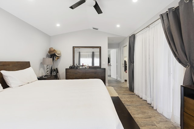 bedroom featuring light wood-type flooring, lofted ceiling, recessed lighting, and ceiling fan