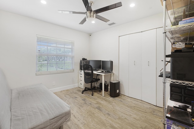 office with light wood-style flooring, a ceiling fan, recessed lighting, and baseboards