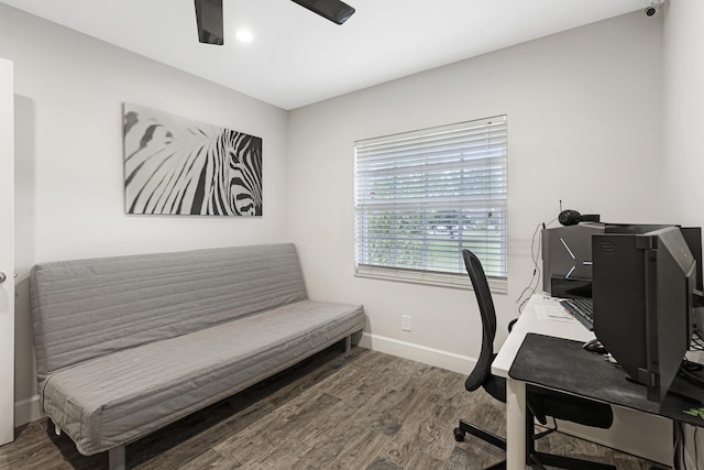 office area featuring a ceiling fan, baseboards, and wood finished floors