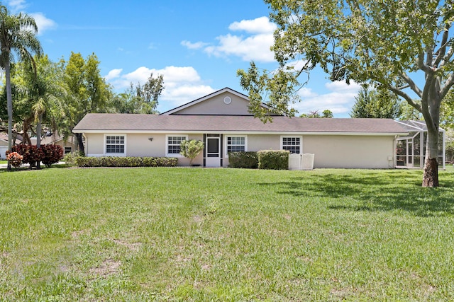 5143 NW 12th Ln, Deerfield Beach, FL 33442 - view of front of house with a front lawn and stucco siding