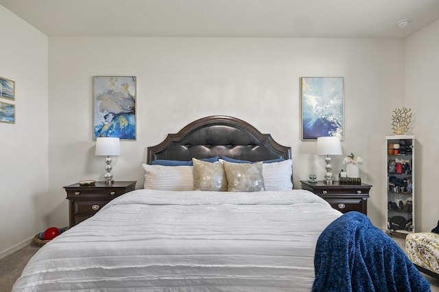 carpeted bedroom featuring baseboards