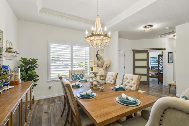 dining area featuring dark wood-style flooring, a chandelier, crown molding, and baseboards
