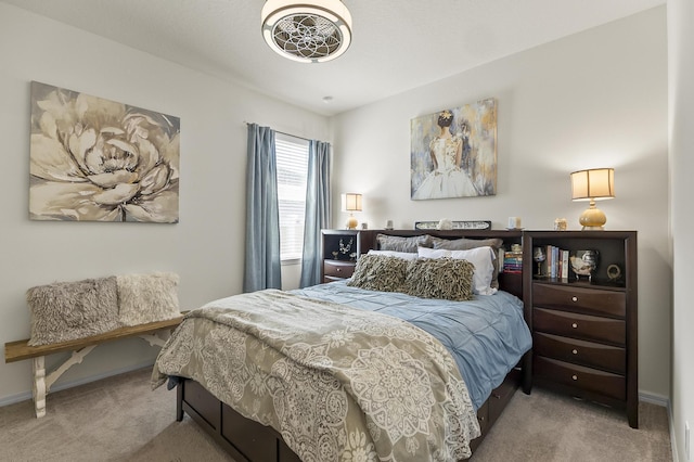 bedroom with carpet flooring and baseboards