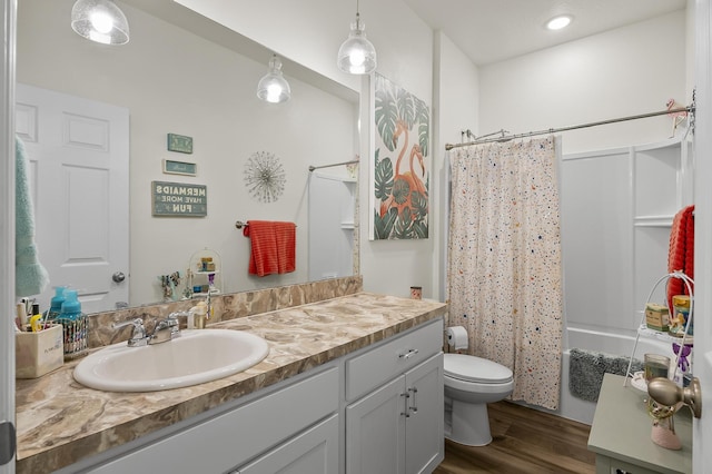 full bathroom with wood finished floors, vanity, toilet, shower / bathtub combination with curtain, and recessed lighting