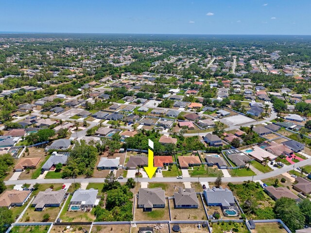 aerial view of property's location featuring nearby suburban area