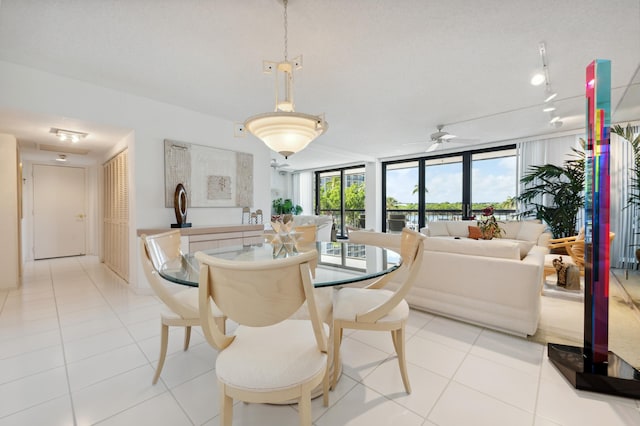 4748 S Ocean Blvd Unit 206, Highland Beach, FL 33487 - dining room featuring plenty of natural light, floor to ceiling windows, ceiling fan, and light tile patterned flooring