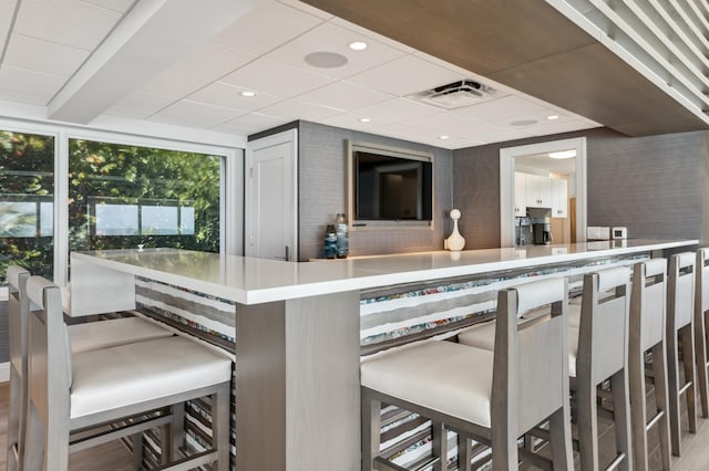 bar area featuring recessed lighting