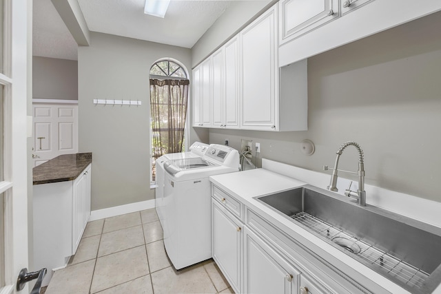 4841 Glenn Pine Ln, Boynton Beach, FL 33436 - laundry room featuring cabinet space, independent washer and dryer, light tile patterned flooring, and baseboards
