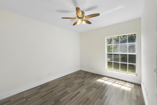 4841 Glenn Pine Ln, Boynton Beach, FL 33436 - unfurnished room with dark wood-style flooring, baseboards, and a ceiling fan