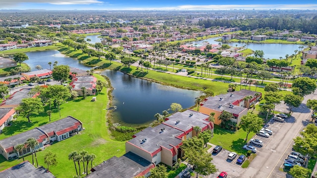 aerial perspective of suburban area with a nearby body of water